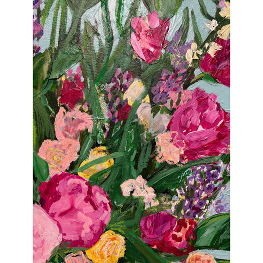 Colorful floral pattern with pink, purple, and yellow flowers on a green background